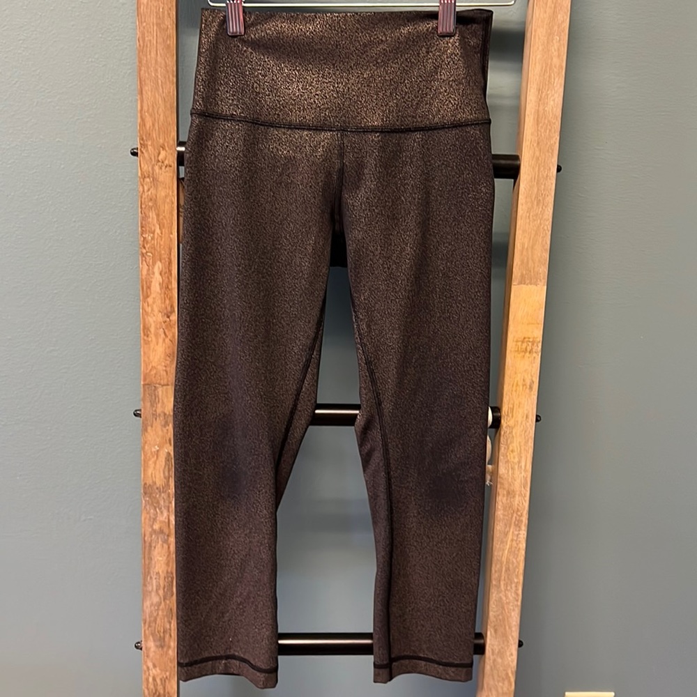 Lululemon Capri leggings. Size 4! Fun color black with gold metallic!